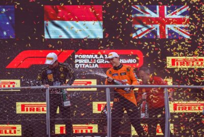 2024年F1意大利大奖赛正赛，冠军勒克莱尔与皮亚斯特里、诺里斯在领奖台上喷洒香槟