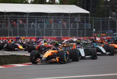 2026年F1加拿大大奖赛正赛起步后，使用半雨胎的诺里斯超越梅赛德斯车群升至榜首