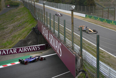 2024年F1日本大奖赛一练，皮亚斯特里驾驶迈凯伦赛车与RB车队的岩佐步梦在铃鹿赛道竞逐