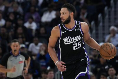 Archive game photo of Ben Simmons handling the ball in Sacramento's No. 25 jersey, not the practice injury