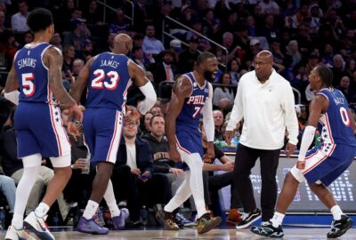 LeBron James, Jaylen Brown, Tyrese Maxey and other 76ers players courtside at the New York–Philadelphia season opener on October 20, 2026; NBA match photo.