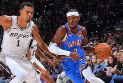 Shai Gilgeous-Alexander handles the ball against Victor Wembanyama in the Thunder–Spurs opener on October 20, 2026; NBA match photo.