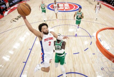 Cade Cunningham attacks the basket against Boston in the 2026–27 season opener; NBA match-report photo.