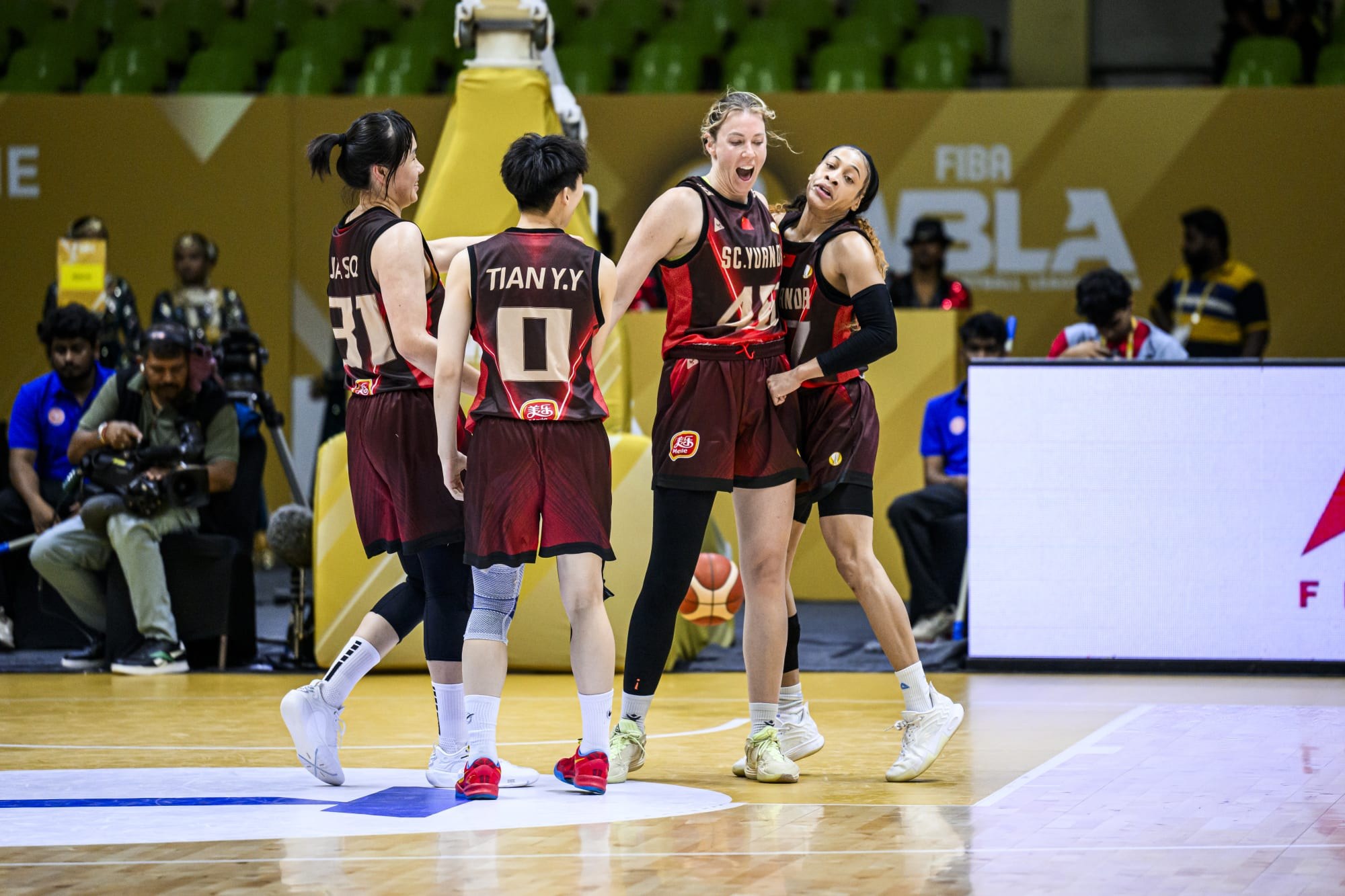 Sichuan Yuanda Meile players celebrate against Akari Sparks in the Women's Basketball League Asia, in a photo from FIBA's match report.