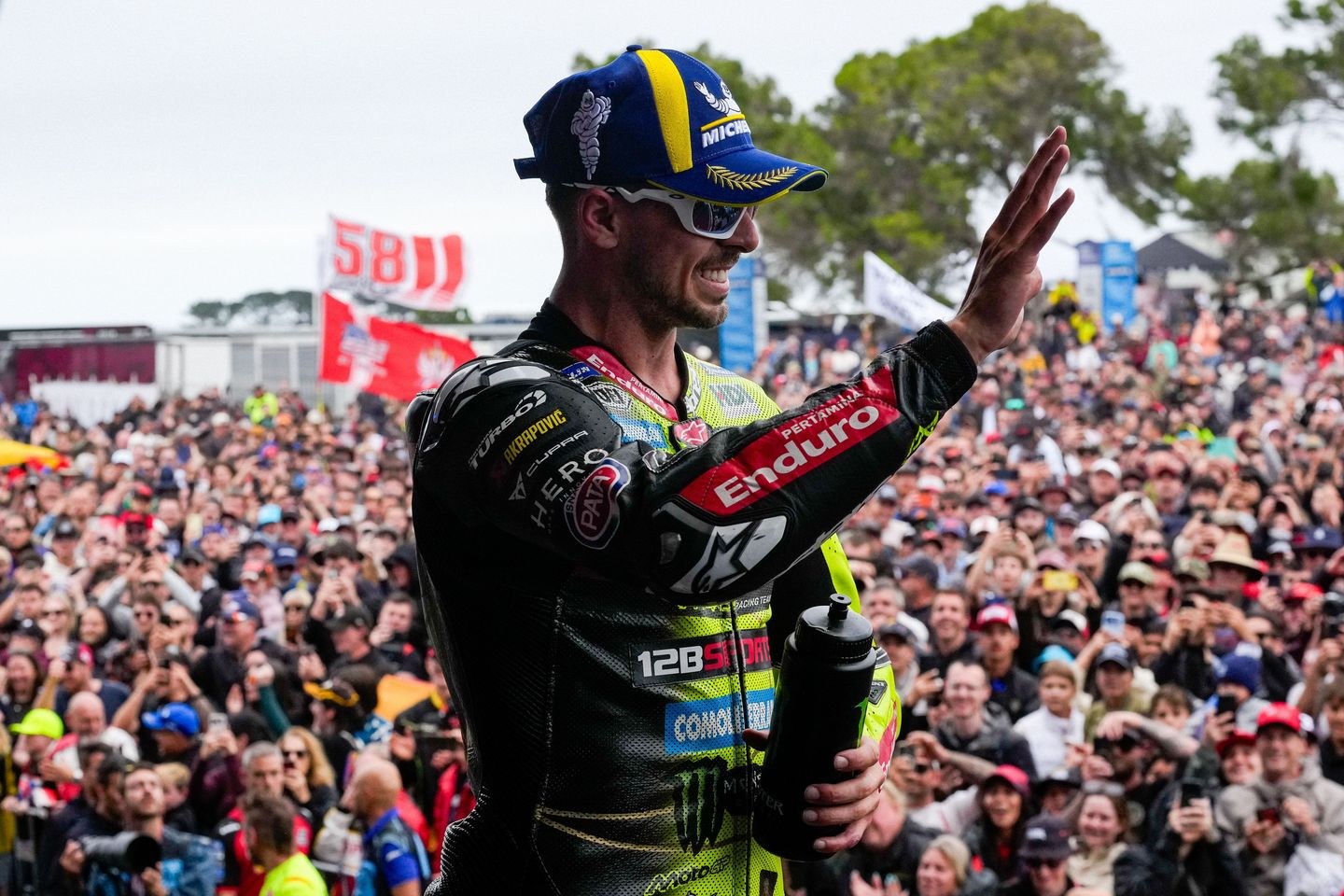 Fabio Di Giannantonio waves to spectators after finishing third in the 2026 Australian MotoGP Sprint.