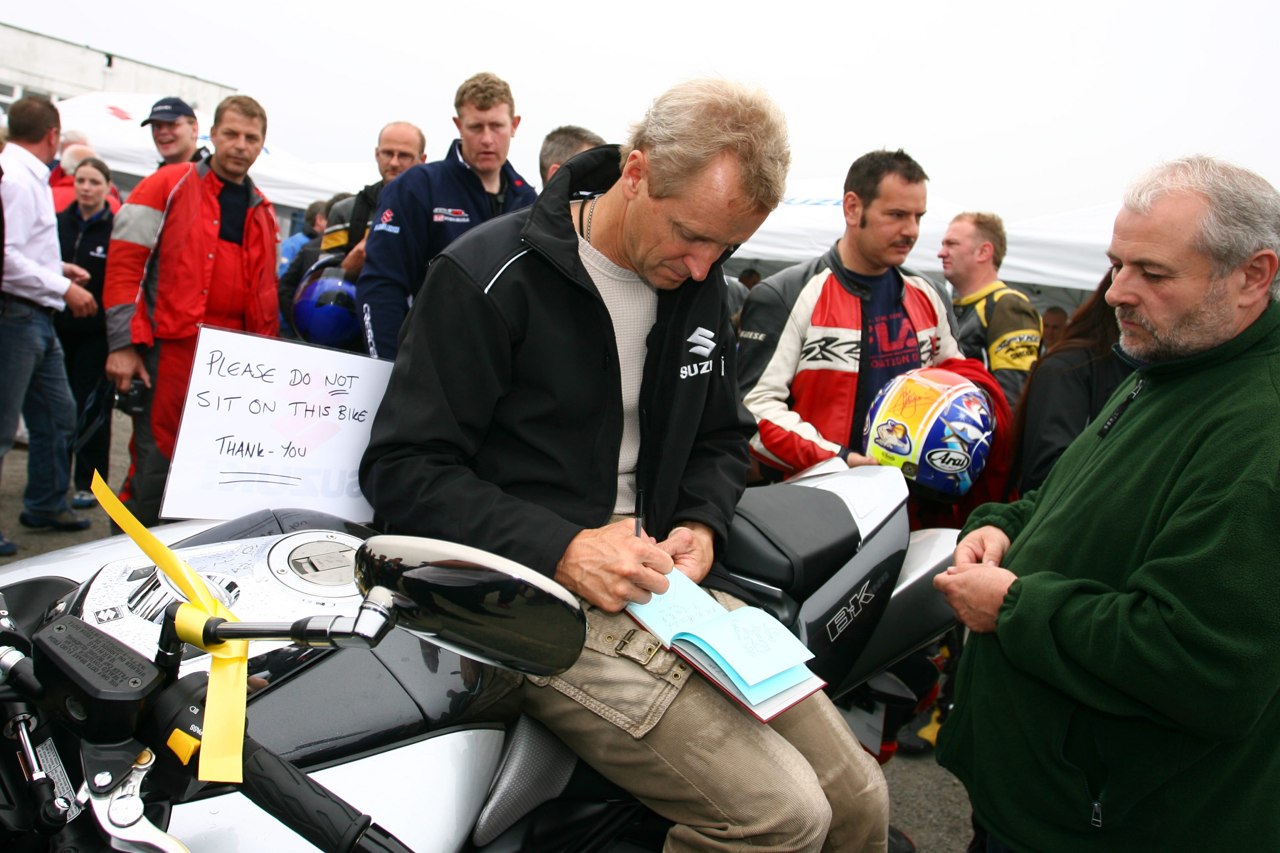 Kevin Schwantz signing autographs for fans after retirement; an archive image supplied with Suzuki Press event news in 2017
