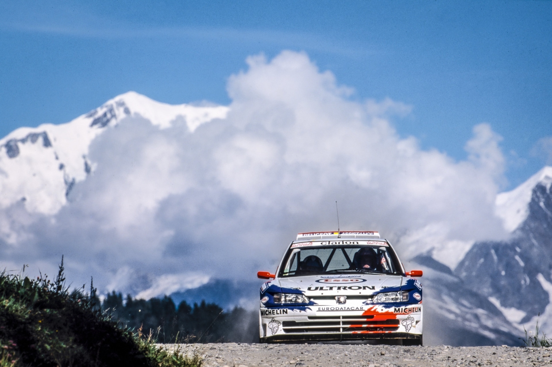 A Peugeot 306 Maxi on mountain roads during the 1997 Rallye Mont-Blanc.