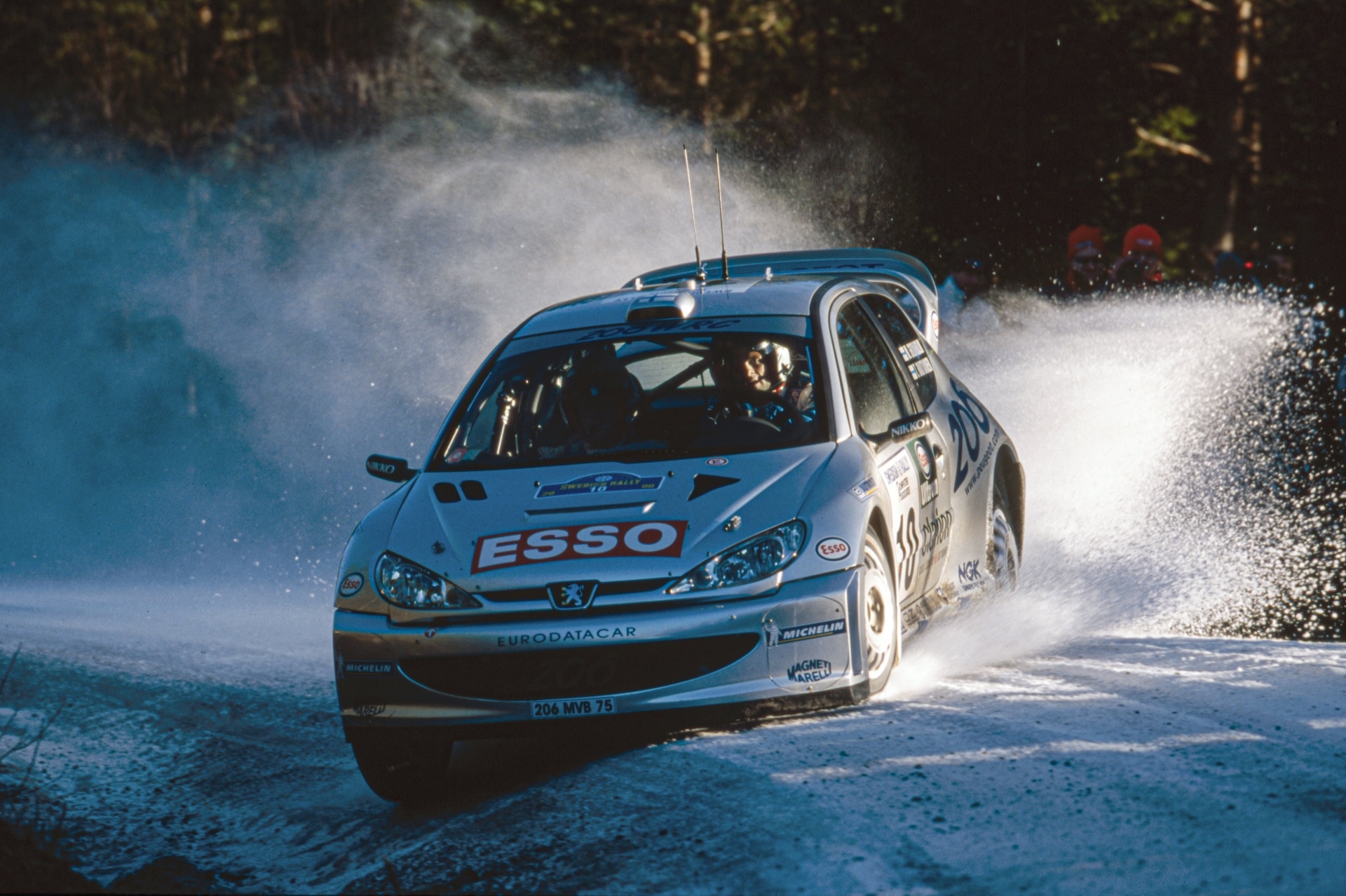 Grönholm driving the No. 10 Peugeot 206 WRC at Rally Sweden in 2000.