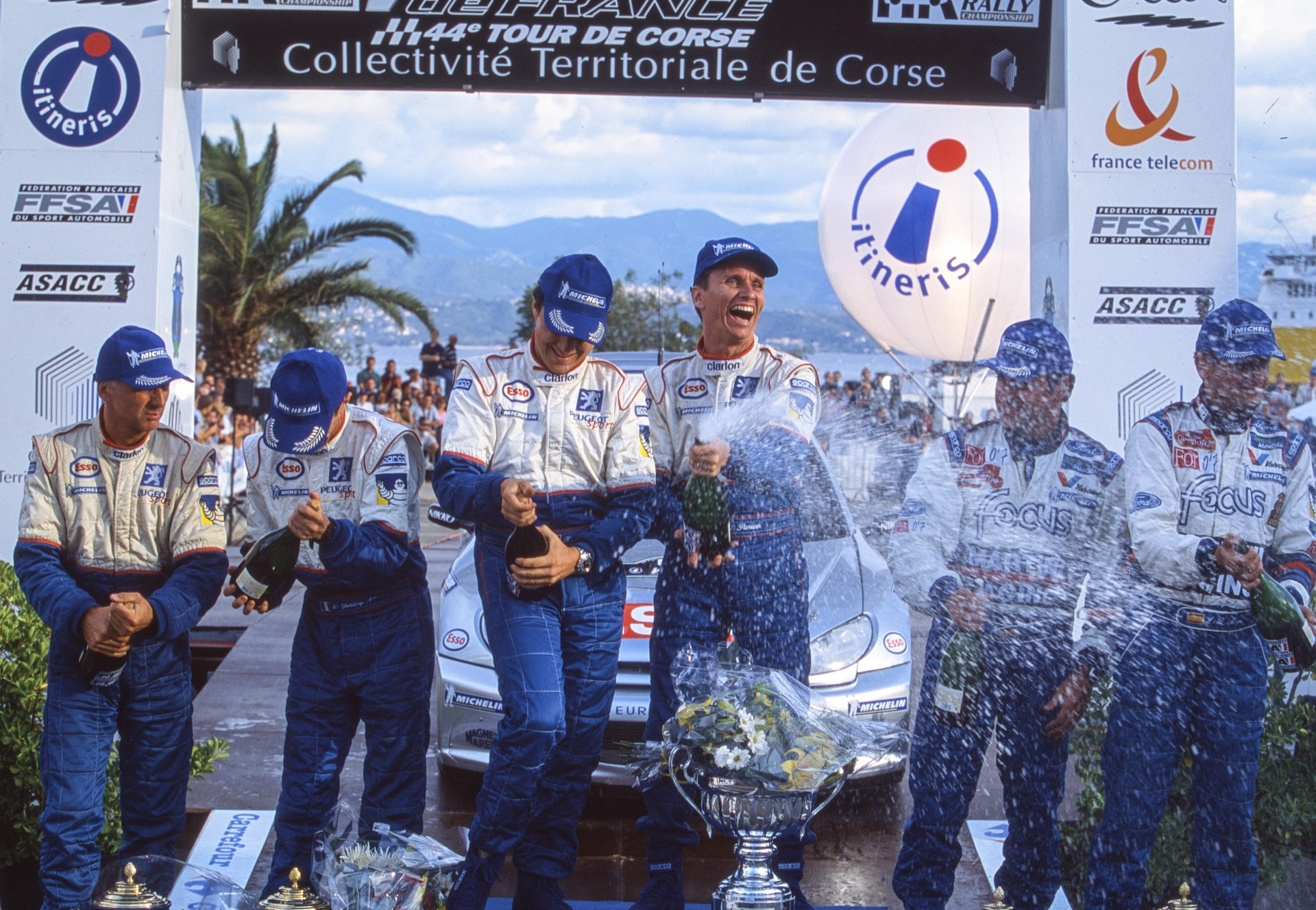 Panizzi, Delecour and other crews on the podium at the 2000 Tour de Corse.