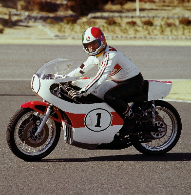 Agostini riding a Yamaha racing motorcycle at the test track in 1974